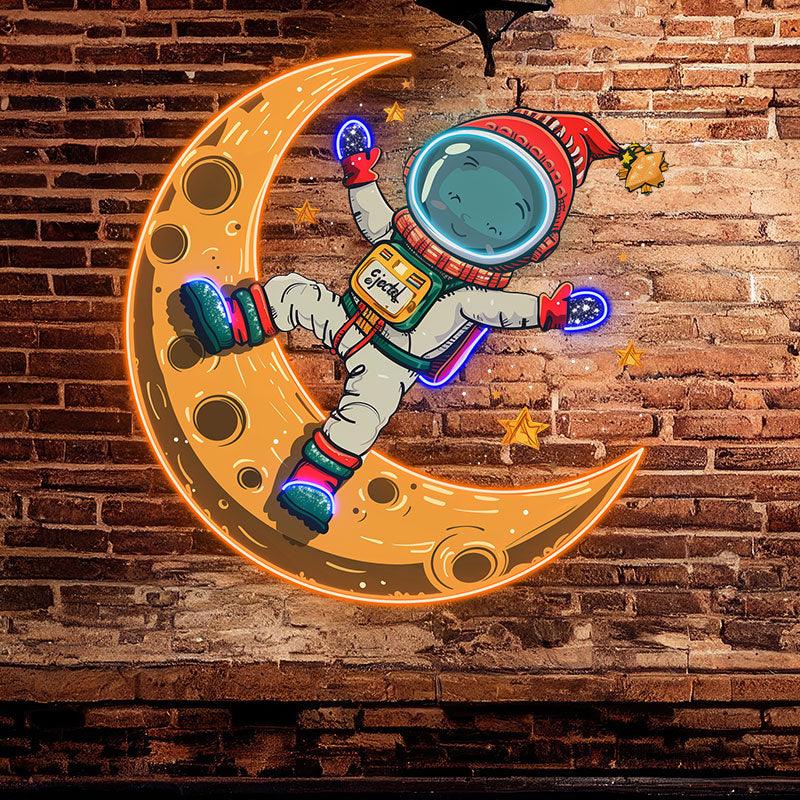 Merry Christmas Astronaut neon signs: A Holiday Miracle Swimming in Space on a Yellow Bent Moon